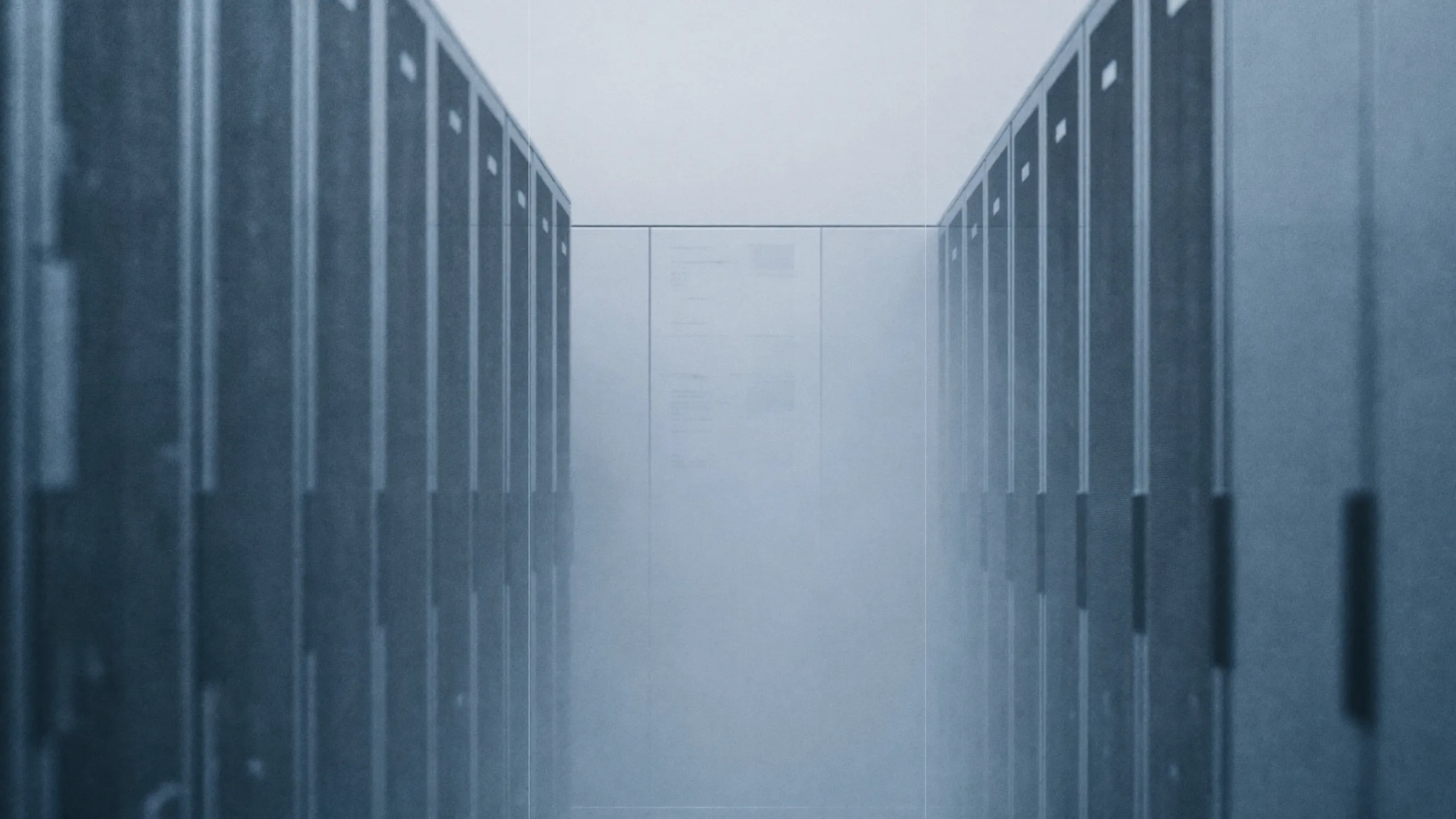 A GPU cluster in a cold lit data hall seen from the aisle